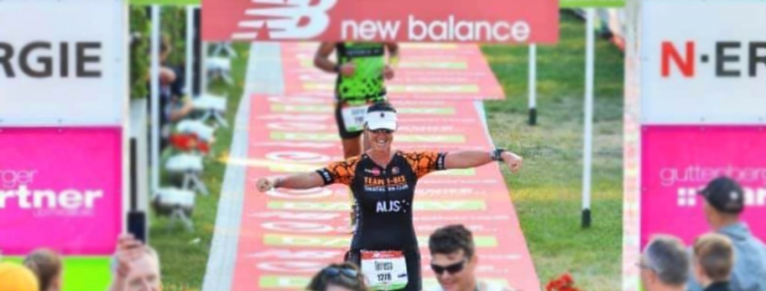 Teresa Theaker Finishing a Triathlon